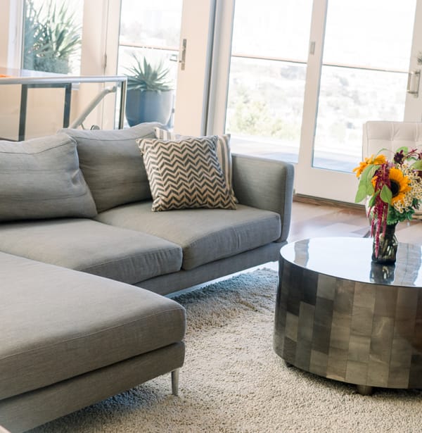 A living room with a sofa and coffee table